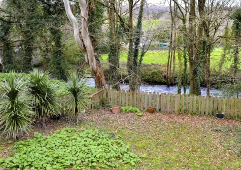 The Camel River runs pas the bottom of the garden at Chapel Barn, Bodmin