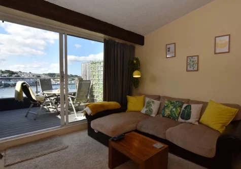 The living room, leads out onto the roof terrace, at Chapel Retreat, Polruan