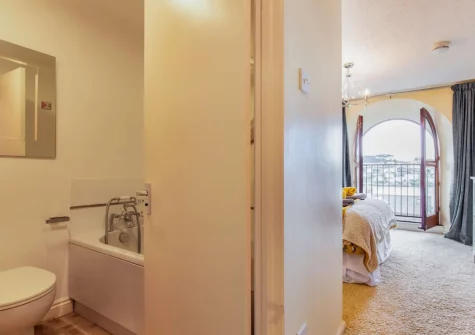 Bedroom #1 & en-suite bathroom at Chapel Retreat, Polruan