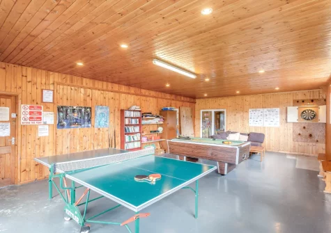 The shared games room with table tennis, darts, pool table & TV at Mettaford Farm, Hartland