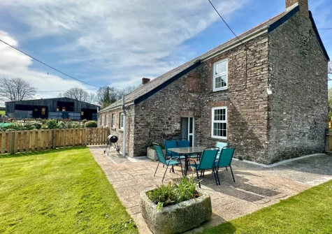 The patio, barbecue, alfresco dining area & enclosed garden at Cherry Cottage, St Issey