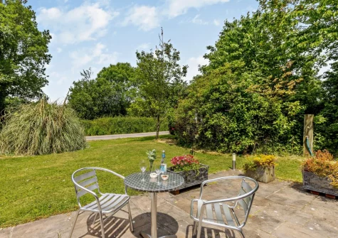 The front patio, outdoor sitting area & garden at Cherry View, South Molton