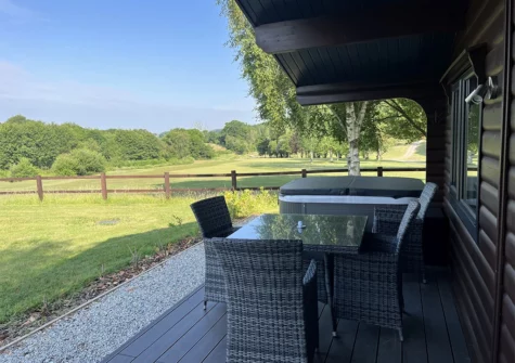 The decked patio & alfresco dining area at Chestnut, 6 Fingle Glen Lodges, Pathfinder Village