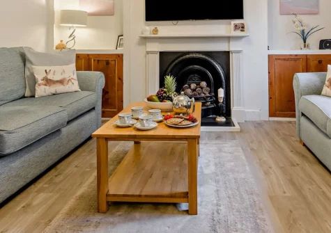 Church Cottage, Little Petherick is a charming two-bedroom period retreat in a peaceful village just three miles from Padstow, featuring characterful interiors, contemporary comforts, and an enclosed patio garden for relaxed Cornish breaks.