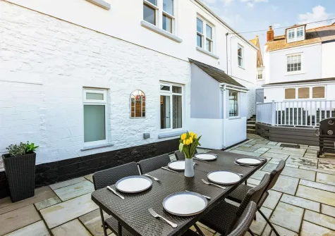 The patio & alfresco dining area at Churchfield Cottage, Appledore