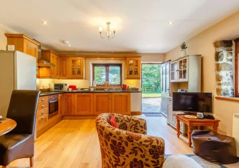 The living area & kitchen at Churn Cottage, Bokiddick