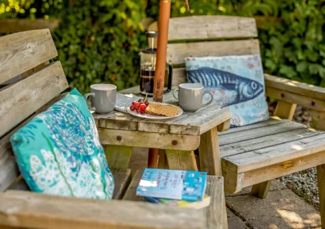 The patio & outdoor sitting area at Churn Cottage, Bokiddick
