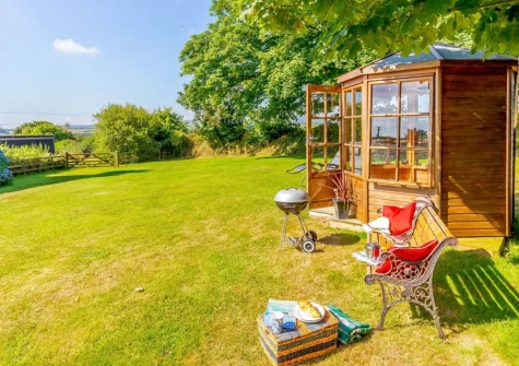The summer house & enclosed garden at Churn Cottage, Bokiddick
