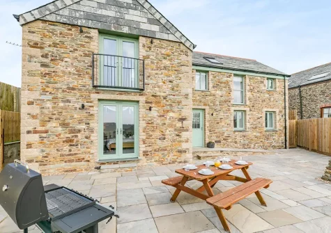 The patio, barbecue & alfresco dining area at Chy Lowen, Penvose Farm, Tregurrian