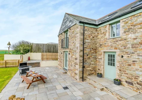The patio, barbecue & alfresco dining area at Chy Lowen, Penvose Farm, Tregurrian