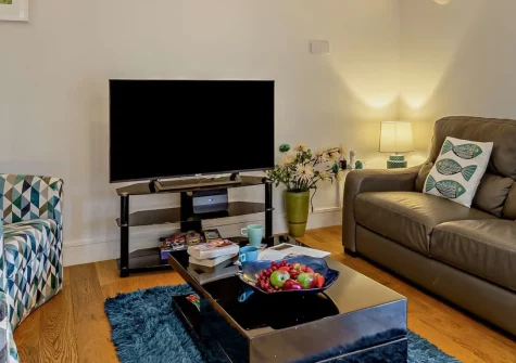 Chy Marner, Charlestown is a characterful ground-floor cottage in the heart of this historic Georgian harbour village, combining exposed beams with stylish interiors, just a two-minute stroll from the town's sandy beach and tall ships.