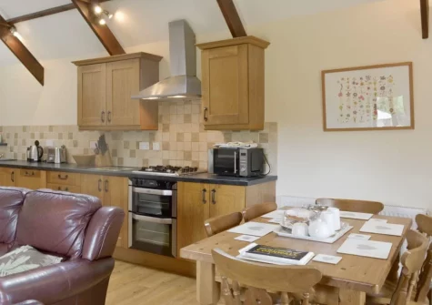 The kitchen & dining area at Cider Barn at Burracott Farm, Week Orchard
