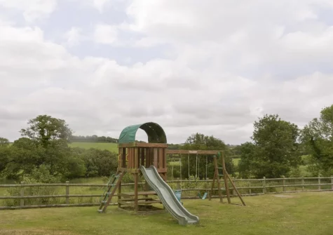 The shared children's play area at Burracott Farm, Week Orchard