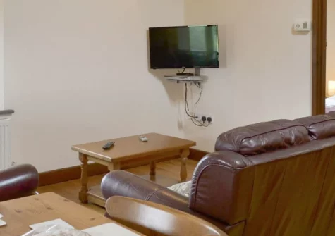 Cider Barn at Burracott Farm, Week Orchard is a characterful three-bedroom barn conversion in peaceful North Devon countryside, featuring an open-plan first-floor living space, private garden with barbecue, and easy access to the dramatic coast.