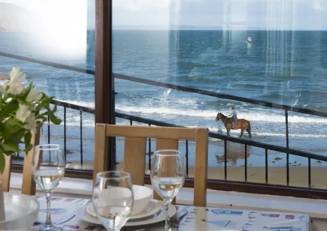 Enjoy beach & sea views from the dining room at Cliff Cottage, Gorran Haven