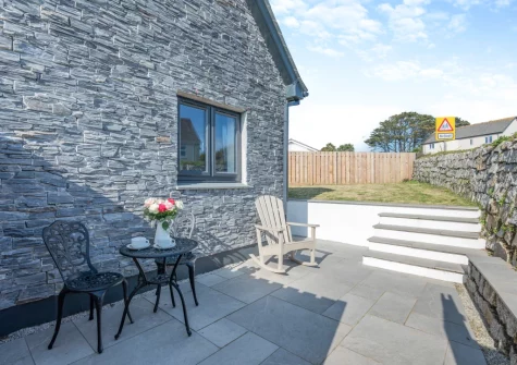 The patio, outdoor sitting area & garden at Clocktower Horizon, Porthleven
