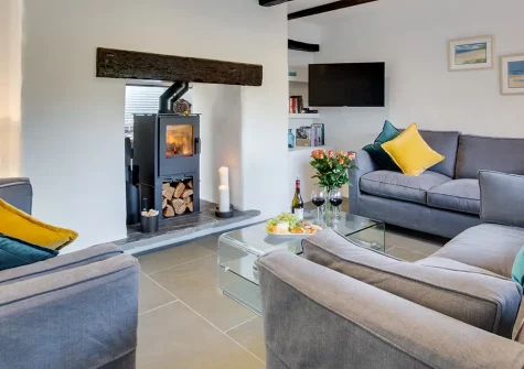 Coachmans, Little Petherick is a spectacular ten-guest home with five bedrooms, games room, and glorious estuary views. Enjoy contemporary comfort, beautiful gardens, and proximity to Padstow's renowned restaurants and North Cornwall's best beaches.