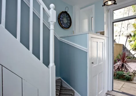 The entrance & stairs up to the fist floor at Coastguard Cottage, Dawlish