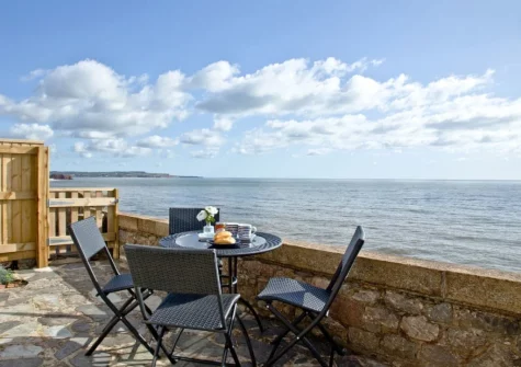 The terrace & outdoor sitting area with fantastic sea view at Coastguard Cottage, Dawlish