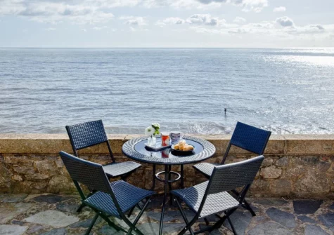 The terrace & outdoor sitting area with fantastic sea view at Coastguard Cottage, Dawlish
