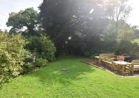 The garden, firepit & outdoor sitting area at Cobbledicks House, Newbridge