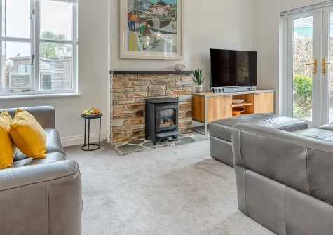 Cockles and Clams, Padstow is a contemporary three-bedroom retreat just 350 metres from the historic harbour. Enjoy modern comforts, a large private patio, distant estuary views, and easy access to Cornwall's golden beaches and attractions.