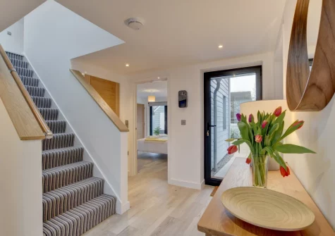 The hallway & stairs up to the first floor at Coco Beach, Westward Ho!