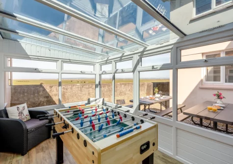 The games room with table football at Codaro, Westward Ho!