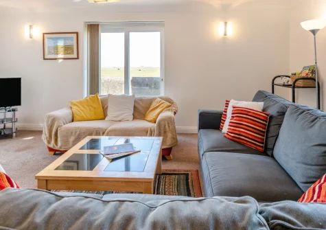 Codaro, Westward Ho! is a spacious five-bedroom detached house on Northam Burrows, boasting stunning sea views, direct access to the golden beach, a games room with table football, and easy reach of North Devon's finest family attractions.