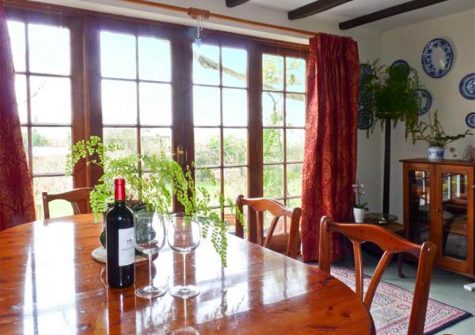 The dining area at Coles Cottage, Derriton