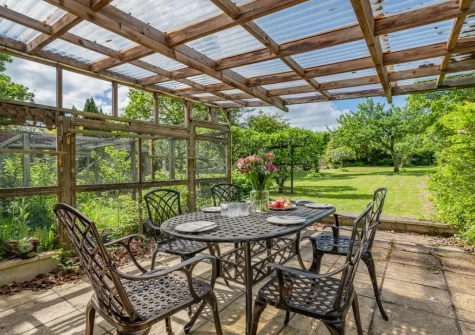 The covered alfresco dining area & lawned garden` at Coliza Farm, St Mewan