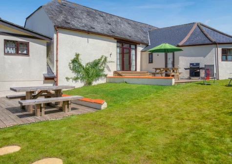 The patio, barbecue, alfresco dining area & enclosed garden at Columbia at Ashcombe Cottages, Ashcombe