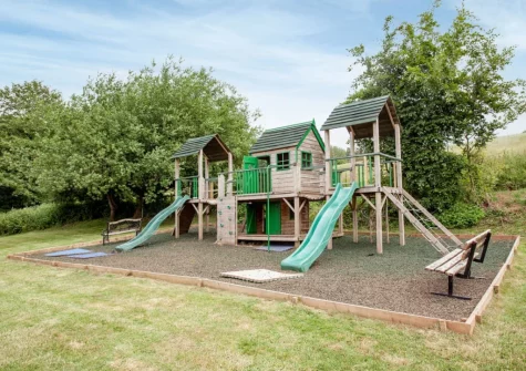 The shared children's outdoor play area at Ashcombe Cottages, Ashcombe