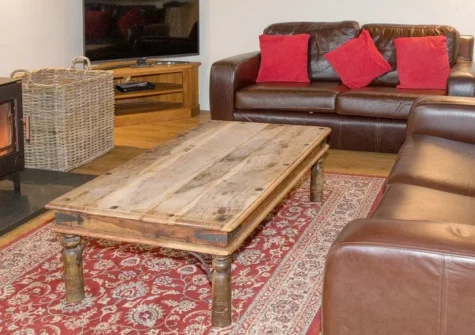Columbia at Ashcombe Cottages is a generous five-bedroom cottage nestled in peaceful Devon countryside, featuring a warming woodburner, five en-suite bedrooms, and welcoming two well-behaved pets, with historic treasures and coastal paths near by.
