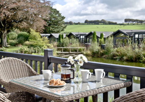 The deck & lake views at Combe Lodge, Kentisbury Grange, Kentisbury