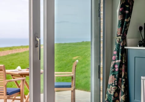 Step out on to the patio, barbecue & alfresco dining area at Combes Barn, Greencliff Farm, Abbotsham