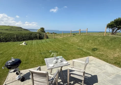 The patio, barbecue, alfresco dining area & garden at Combes Barn, Greencliff Farm, Abbotsham