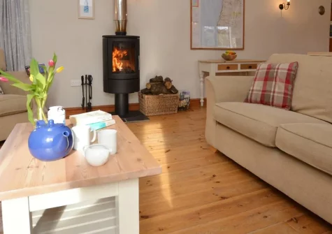 Coombe Barn, Gooseham is a contemporary barn conversion set within 267 acres of stunning organic dairy farmland. Enjoy spectacular countryside views, farm activities, all-weather play barn, and easy access to Cornwall's beautiful coastline.