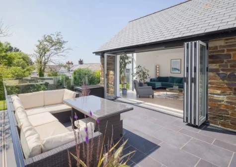 The patio terrace & alfresco dining area at Coombe Rise, Poughill