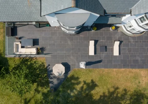 The patio terrace, alfresco dining area & garden at Coombe Rise, Poughill
