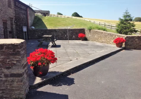 Enjoy rolling countryside views from the patio & alfresco dining area