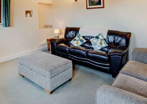 Coombe View at Spirewell Farm, Wembury is a characterful converted barn with glorious valley views across rolling Devon countryside, featuring flexible family accommodation, a peaceful patio for al fresco dining, and easy access to Wembury Beach.