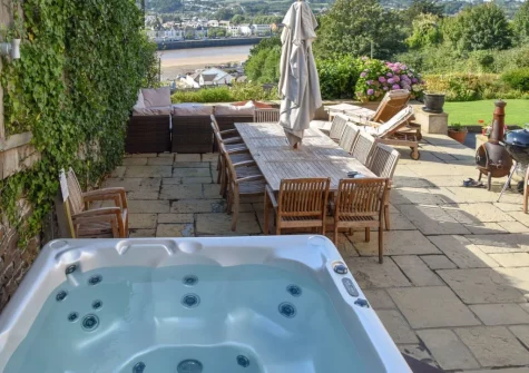 The patio, hot tub & alfresco dining area at Copperfield, Bideford