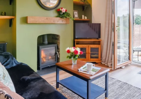 Coppermoor, Horrabridge is a traditional two-bedroom cottage set within Dartmoor National Park, featuring a cosy wood burner, sunny south-facing gardens, and flexible bedroom arrangements, perfect for exploring Devon's dramatic moorland landscapes.