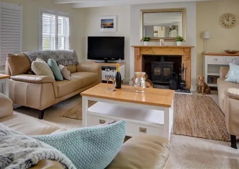Corner Cottage, Trevarren is an elegant three-bedroom cottage combining tradition with contemporary comfort. Enjoy sophisticated interiors and your private terraced garden. Perfect for families seeking Cornish countryside charm & beach adventures.