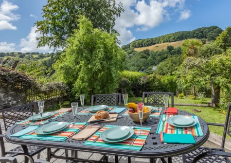 The patio & alfresco dining area at Court Cottage, Berrynarbor