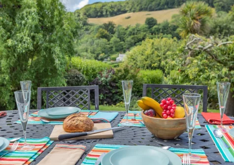The patio & alfresco dining area at Court Cottage, Berrynarbor
