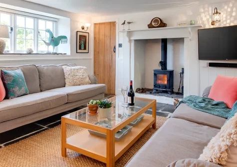 Court Cottage, Berrynarbor is a charming Grade II-listed 3-bedroom retreat blending 18th-century character with modern comfort. Enjoy stunning countryside views, manicured gardens, and North Devon's coast. Perfect for memorable family escapes.