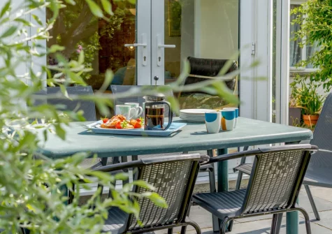The patio & alfresco dining area at Cowries, Constantine Bay