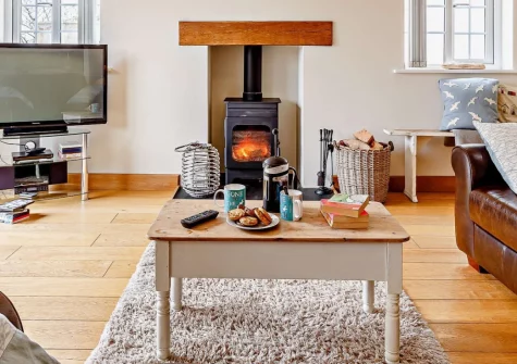 Crabbe Cottage, Poughill is a charming two-bedroom retreat on the edge of a peaceful village, featuring a large enclosed garden with sweeping sea views, a cosy wood burner, and easy access to Cornwall's dramatic north coast and legendary beaches.